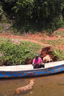 Peter watches dog swim in the Nile